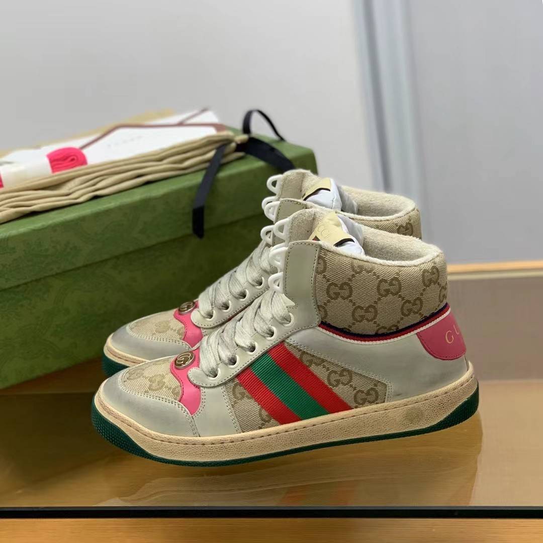 GU*IHigh-top Distressed sneakers